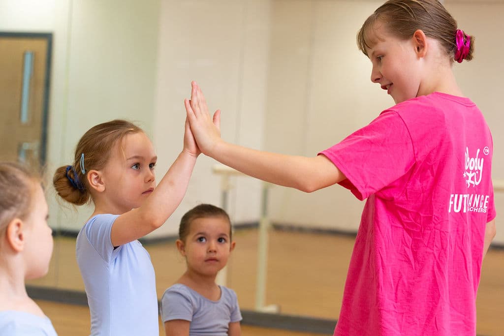 Future Dance Teacher mentoring a younger dancer at En Pointe Cardiff